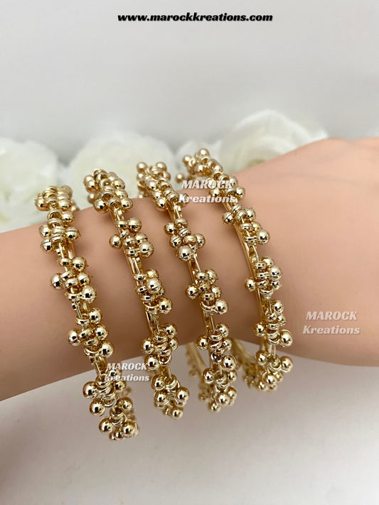 Bailey Gold toned ghungroo style clusters bangles (come in a pair)
