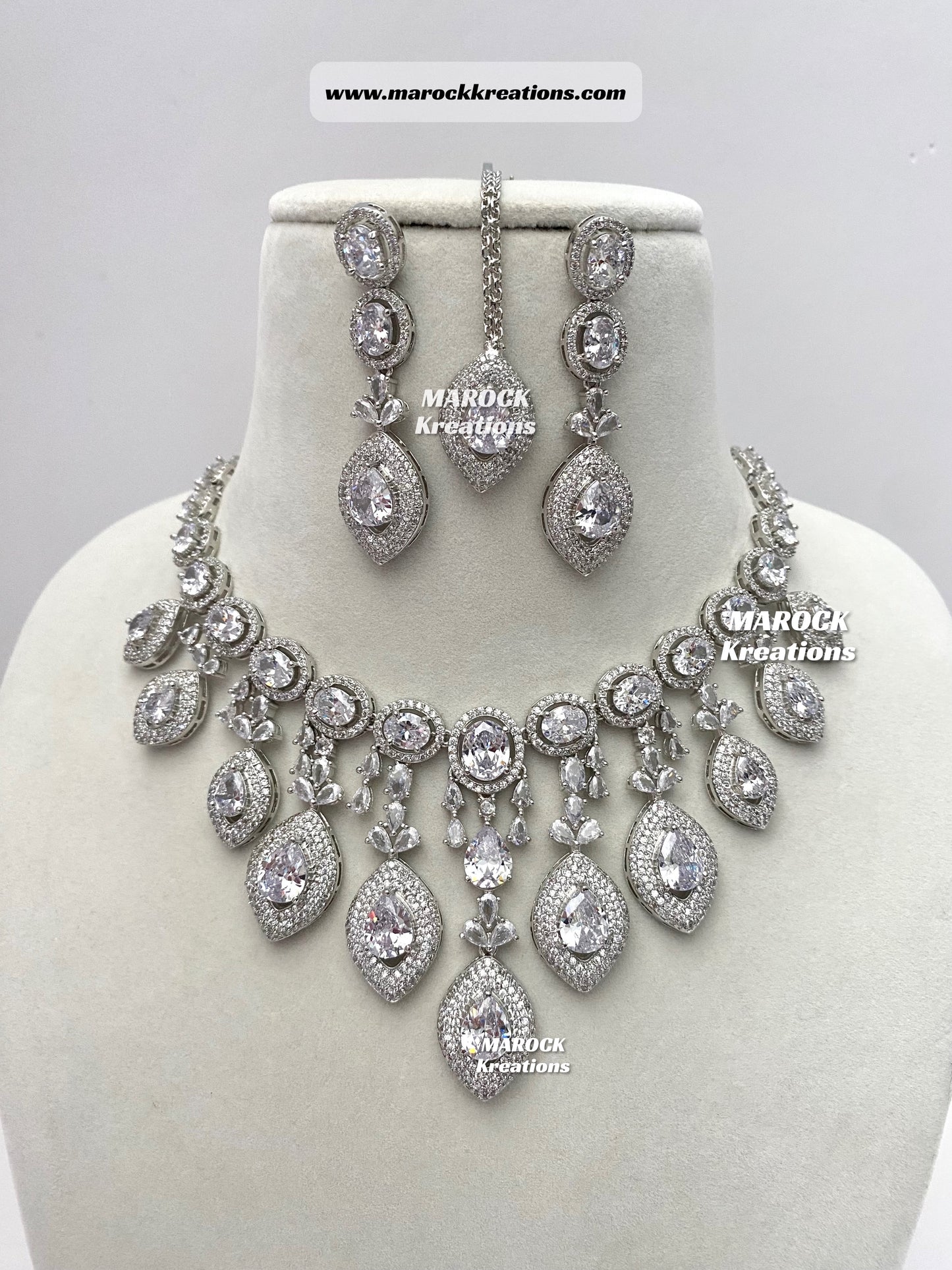 Silver American Diamond Necklace set comes with earrings and tikka